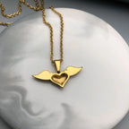 Necklace with angel wings and heart pendant