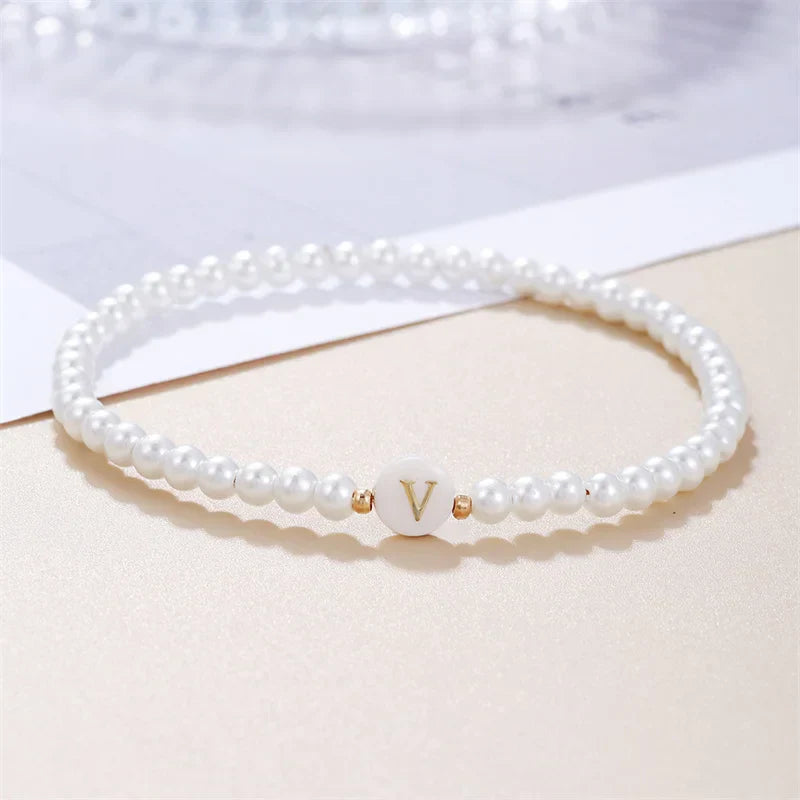 White bracelet initial V