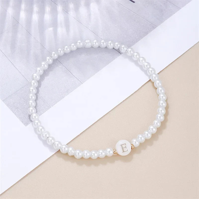 White bracelet initial E