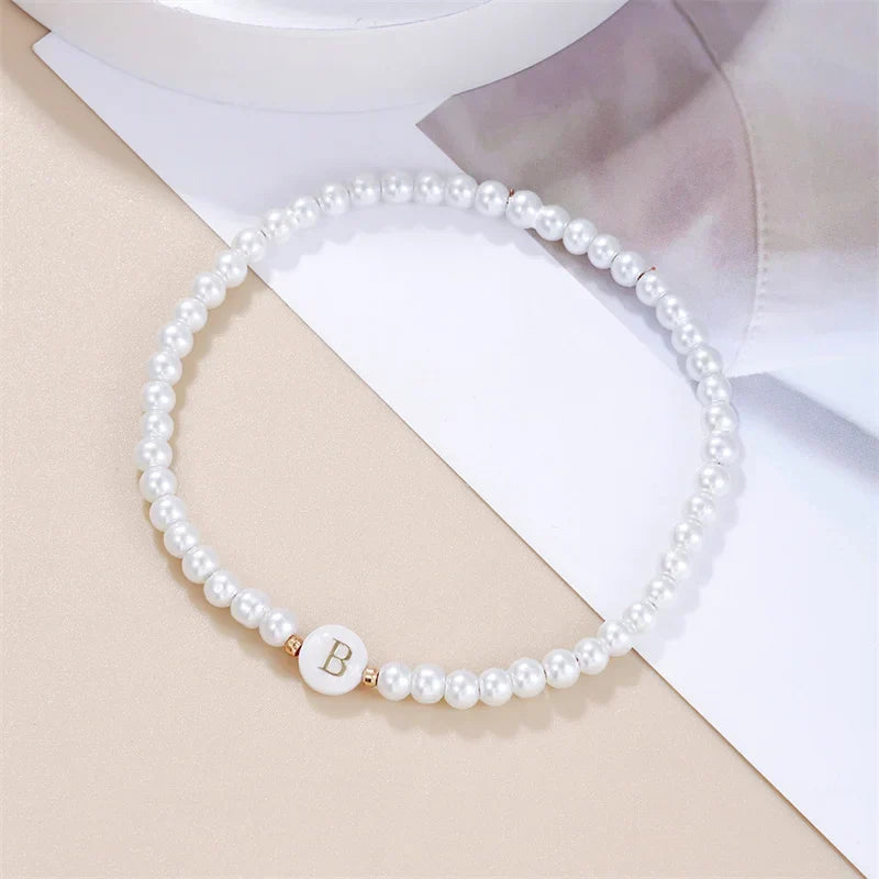 White bracelet initial B