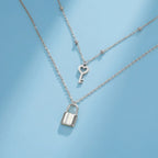 Double necklace with silver key and lock pendant