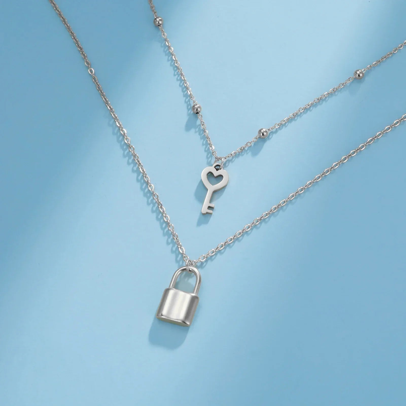 Double necklace with silver key and lock pendant