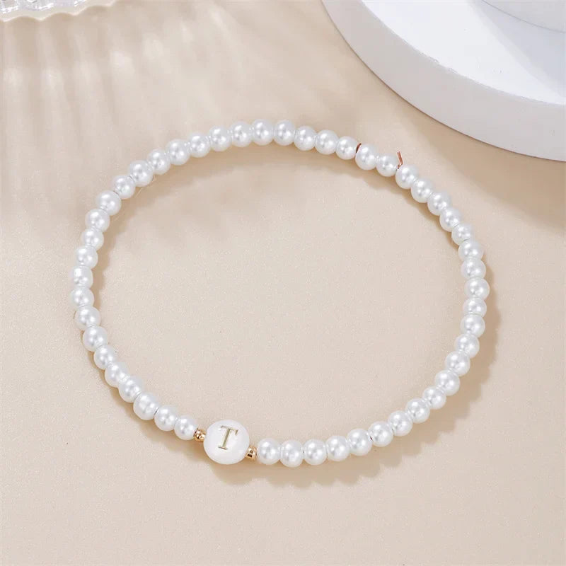 White bracelet initial T