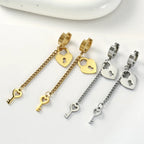 Gold key and lock drop earrings