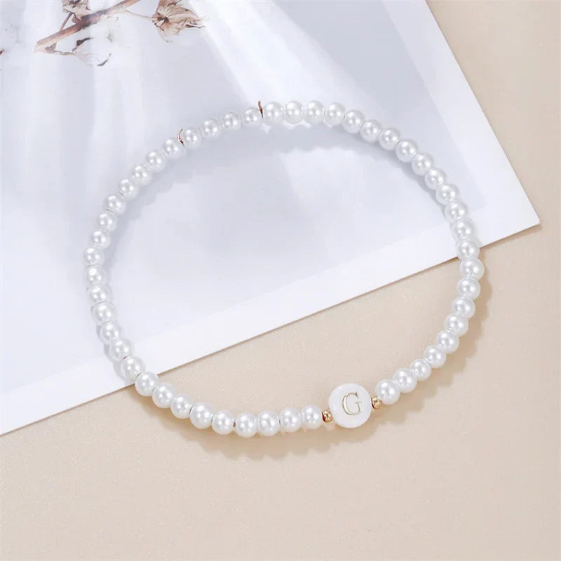 White bracelet initial G