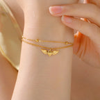 Adjustable angel wings gold bracelet
