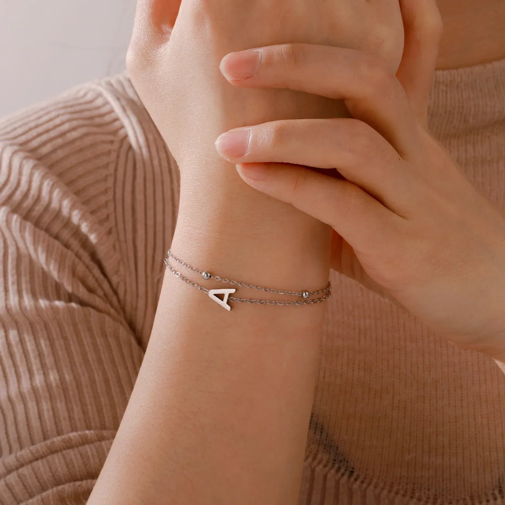 Double initial bracelet in gold and silver 