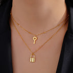 Double necklace with gold key and lock pendant