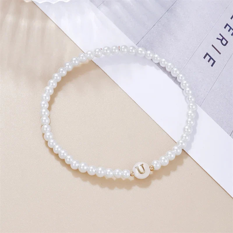 White bracelet initial U