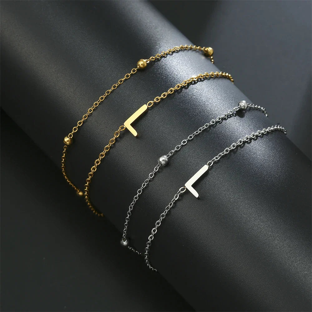 Double initial bracelet in gold and silver  l