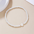 White bracelet initial J
