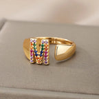 Wide personalized ring with rainbow initial m