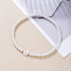 White bracelet initial L