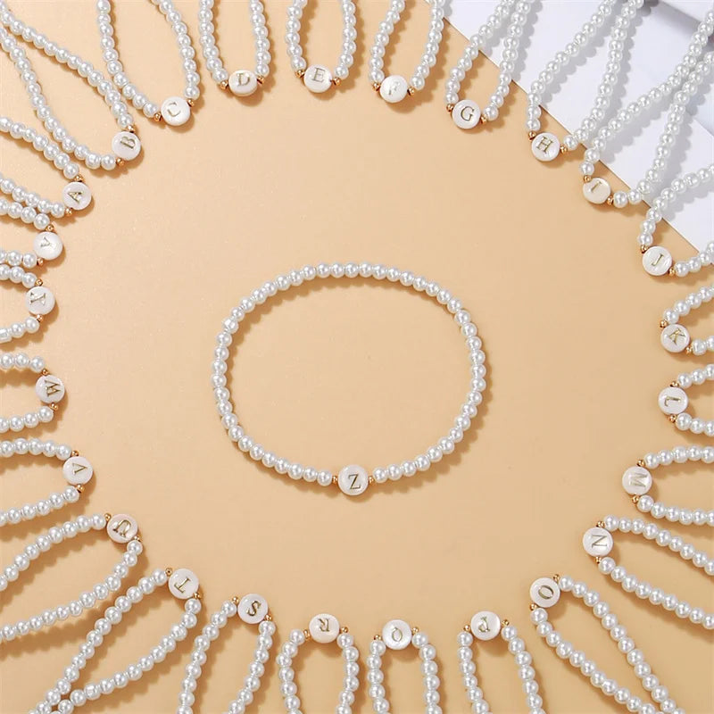 White bracelet initial M