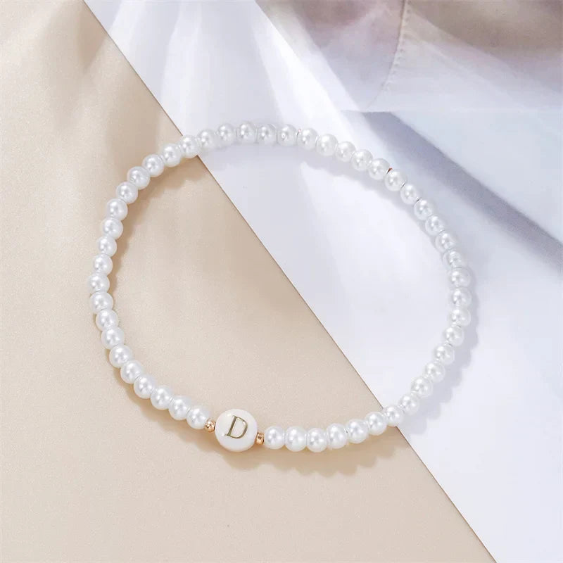 White bracelet initial D