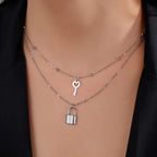 Double necklace with silver key and lock pendant
