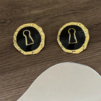 Black key round earrings