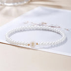 White bracelet initial R