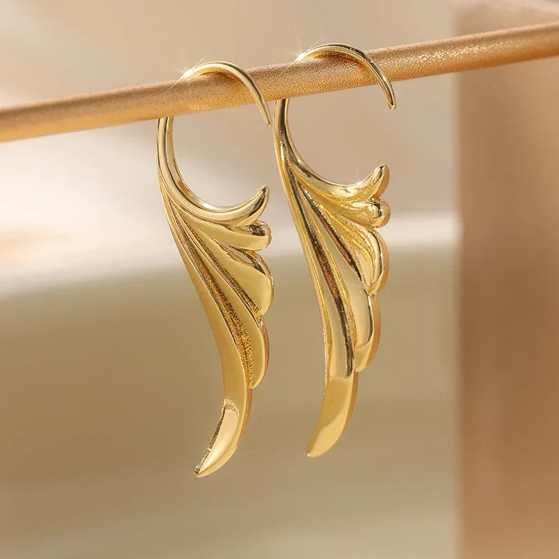 Gold women's angel wing dangle earrings