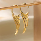 Gold women's angel wing dangle earrings