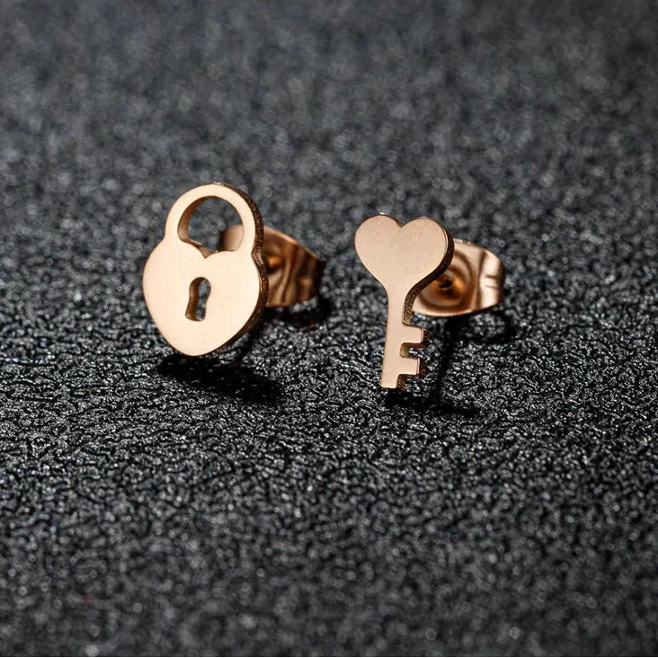 Minimalist key and lock earrings rose gold