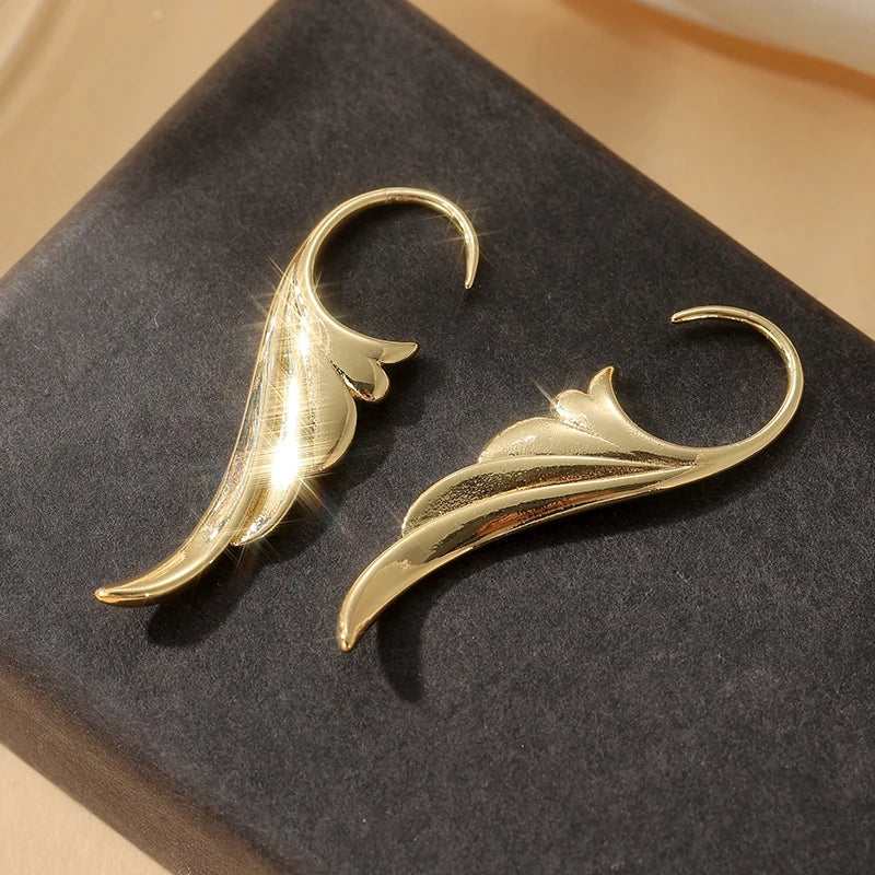 Gold women's angel wing dangle earrings