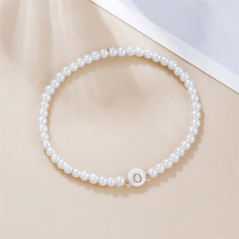 White bracelet initial O