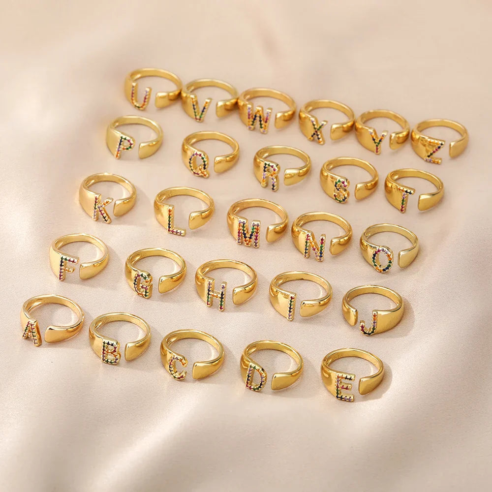 Wide personalized ring with rainbow initial