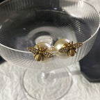 Bee and white pearl earrings