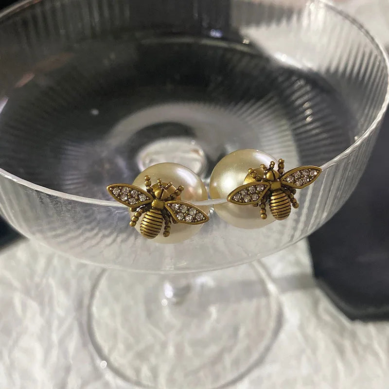 Bee and white pearl earrings
