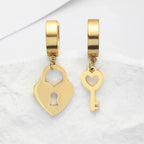 Gold key and padlock hoop earrings