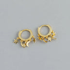 Star and Moon Dangle Hoop Earrings in gold