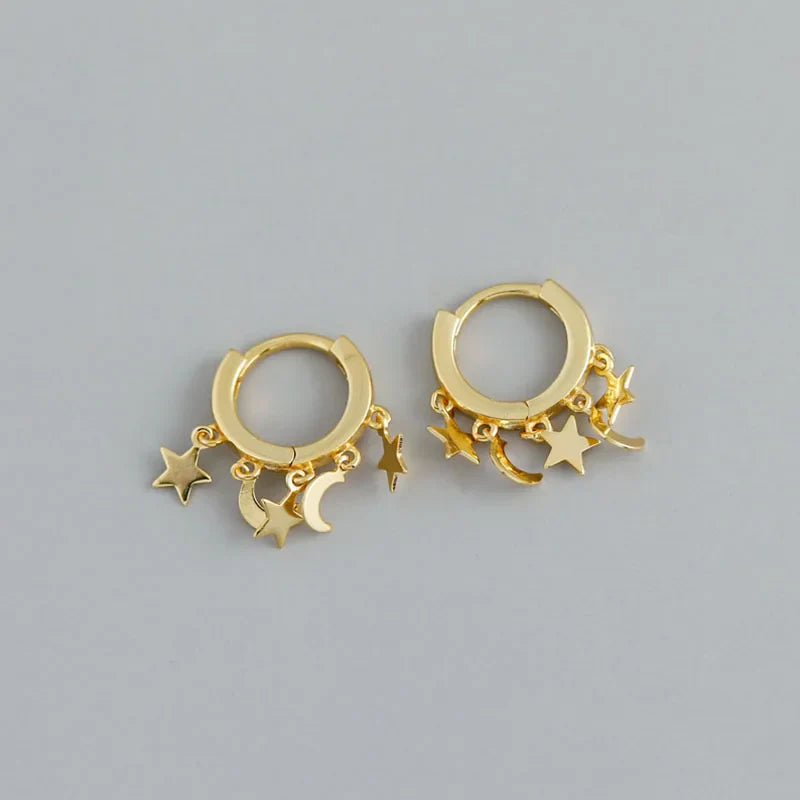 Star and Moon Dangle Hoop Earrings in gold