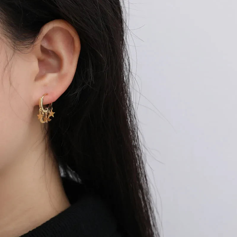 Star and Moon Dangle Hoop Earrings in gold