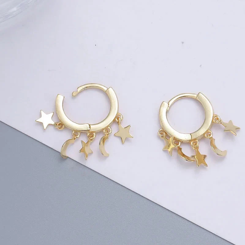 Star and Moon Dangle Hoop Earrings in gold