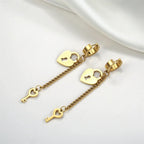 Gold key and lock drop earrings
