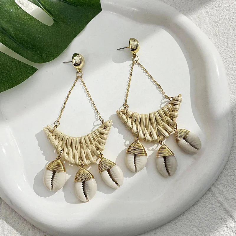 Nature-Inspired Dangling Earrings with Cowrie Shell Design