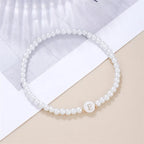 White bracelet initial E