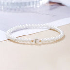 White bracelet initial F