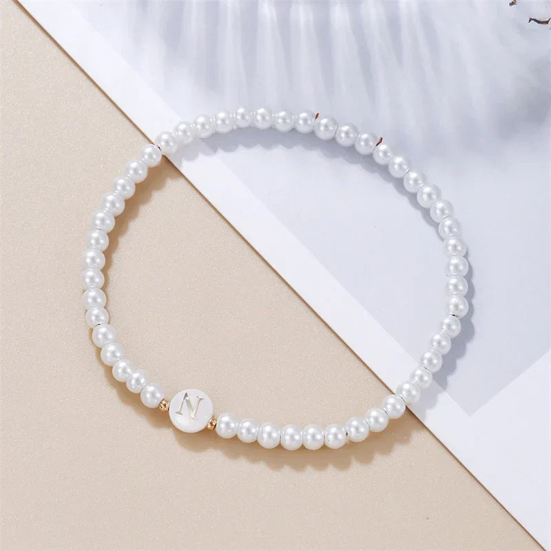 White bracelet initial N