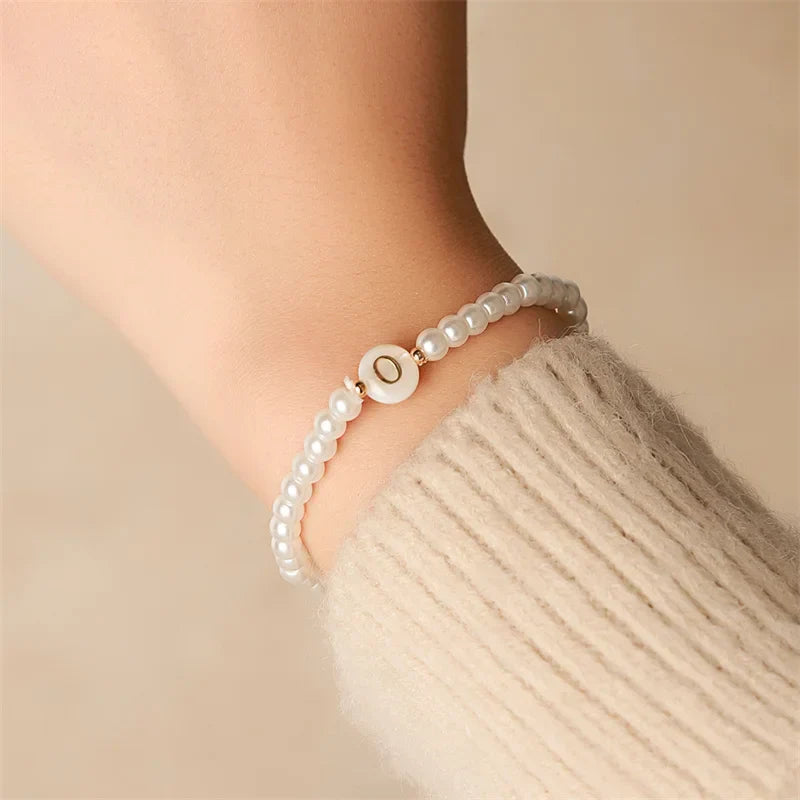 White bracelet initial O