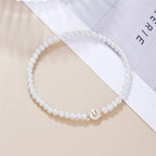 White bracelet initial U