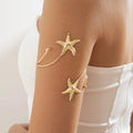 Boho women's arm bracelet - gold starfish bicep chain