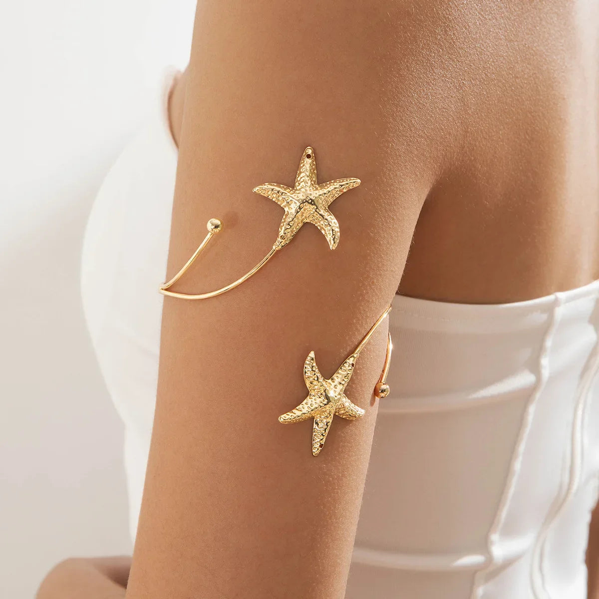 Boho women's arm bracelet - gold starfish bicep chain