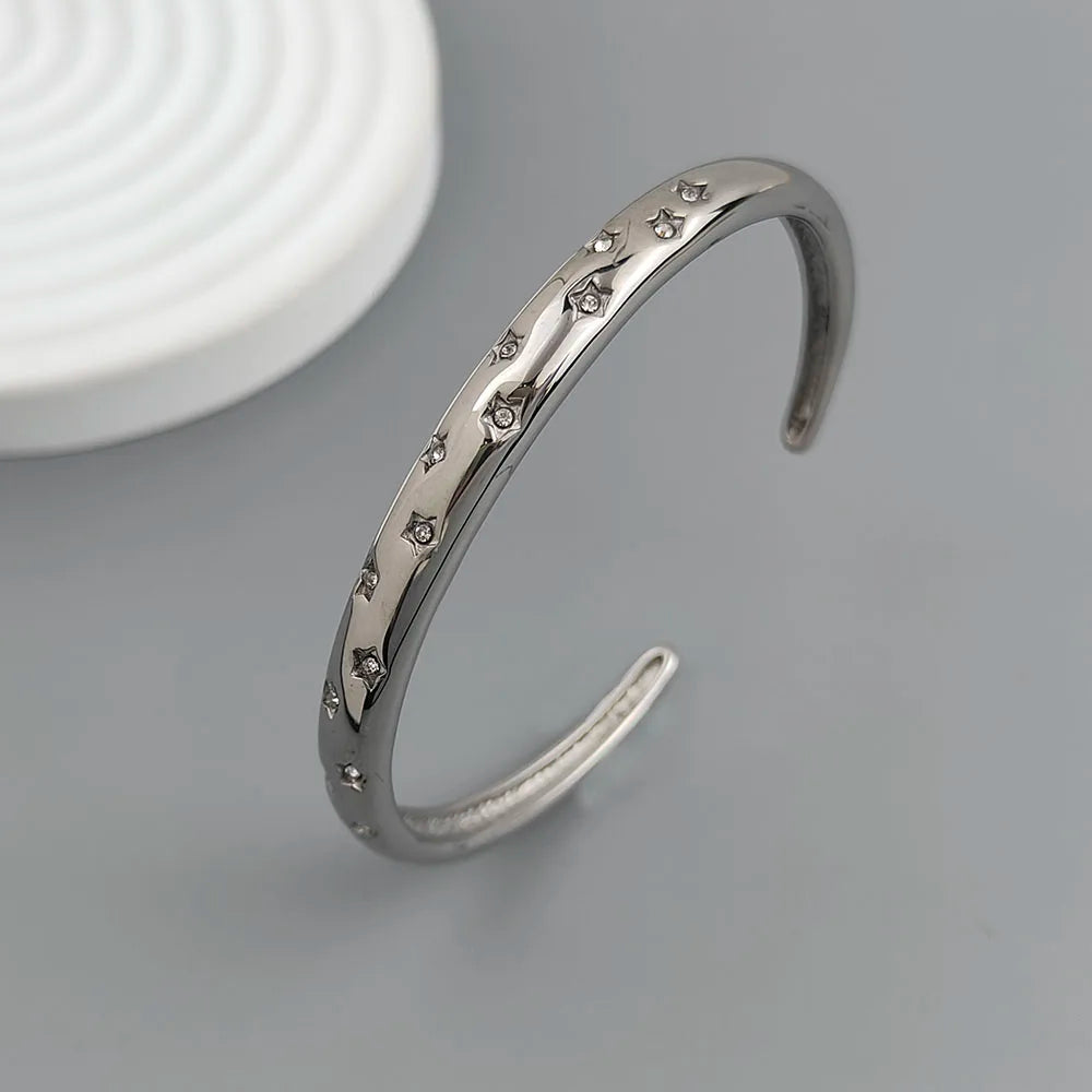 Elegant Bracelet with Star and Celestial Motifs Silver