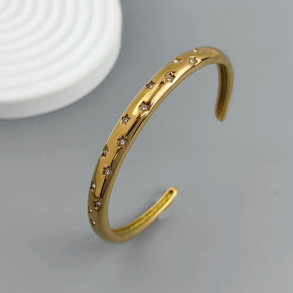 Elegant Bracelet with Star and Celestial Motifs Gold