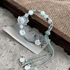 Bracelet with Cord, Beads and Lotus Flower