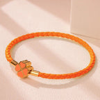 Braided Leather Bracelet with Orange Four-Leaf Clover