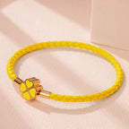 Braided Leather Bracelet with Yellow Four-Leaf Clover