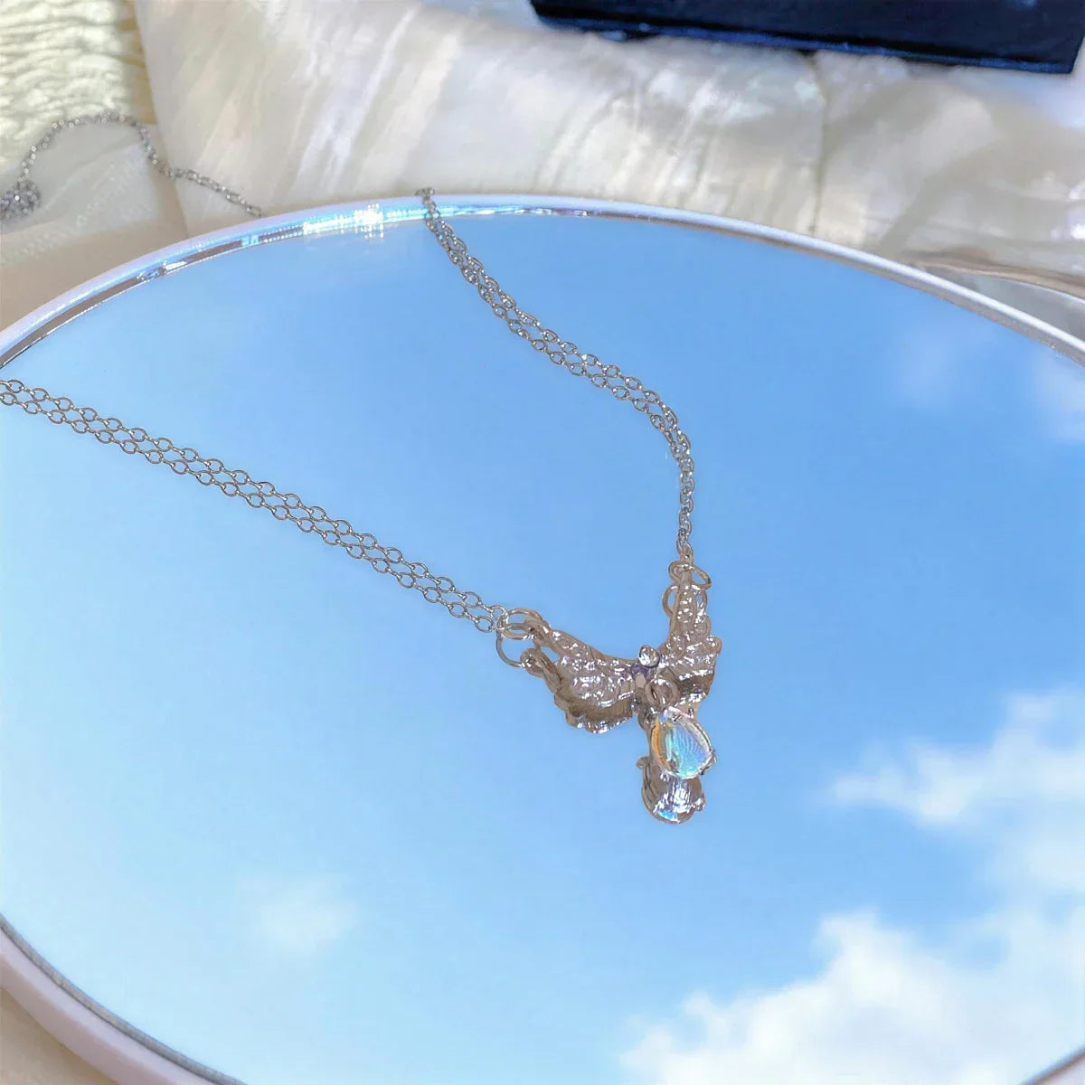Necklace with angel wings pendant
